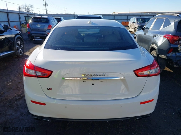 2014 Maserati Ghibli S Q4 with VIN ZAM57RTA1E1096387, listed as a IAAI auction lot 41424049 with 100,970 mi miles. Bid and sale history available at carsss.com. Image 16.