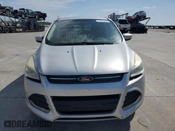 2013 Ford Escape SE с VIN 1FMCU0G9XDUA41798, выставлен на аукционе Copart как лот 57460025 с пробегом 137 816 миль миль и Списание • Salvage title. История ставок и продаж доступна на DreamBid. Изображение 5.