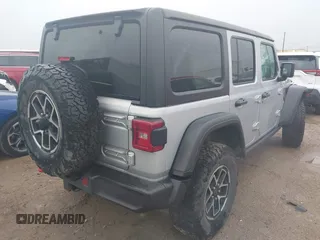 2024 Jeep Wrangler Rubicon with VIN 1C4PJXFG7RW252959, listed as a IAAI auction lot 41955302 with 27,727 mi miles and . Bid and sale history available at DreamBid. Image 4.