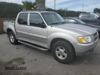 2003 Ford Explorer Sport Trac XLS with VIN 1FMZU67E33UA26245, listed as a Copart auction lot 47224405 with 113,009 mi miles and Salvage title. Bid and sale history available at DreamBid. Image 4.