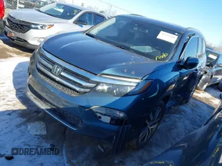 2016 Honda Pilot Elite with VIN 5FNYF6H04GB060786, listed as a IAAI auction lot 41335550 with 152,863 mi miles. Bid and sale history available at carsss.com. Image 2.
