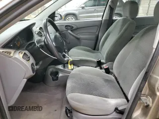 2003 Ford Focus LX with VIN 1FAFP33P63W257719, listed as a Copart auction lot 83937554 with 75,967 mi miles and Salvage Title. Bid and sale history available at carsss.com. Image 7.