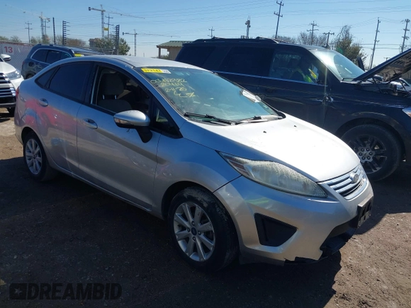 2013 Ford Fiesta SE z VIN 3FADP4BJ0DM204414, wystawiony jako IAAI lot #41644015 z przebiegiem 110 977 mil mil oraz . Historia ofert i sprzedaży dostępna na DreamBid. Obrazek 1.