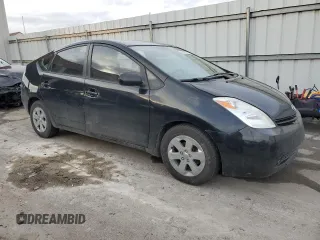 2005 Toyota Prius z VIN JTDKB20U653052272, wystawiony jako Copart lot #52339475 z przebiegiem 299 999 mil mil oraz Nie do naprawy • Non repairable. Historia ofert i sprzedaży dostępna na DreamBid. Obrazek 4.