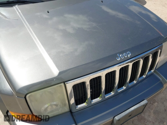 2007 Jeep Commander Sport z VIN 1J8HG48P87C647870, wystawiony jako IAAI lot #42185954 z przebiegiem 269 402 mil mil oraz . Historia ofert i sprzedaży dostępna na DreamBid. Obrazek 6.