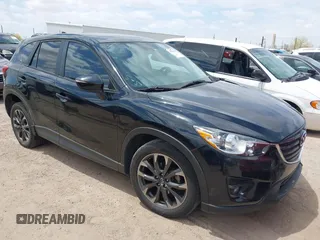 2016 Mazda CX-5 Grand Touring with VIN JM3KE4DYXG0820962, listed as a IAAI auction lot 42185888 with 157,821 mi miles and . Bid and sale history available at DreamBid. Image 1.