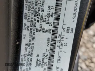 2018 Ford Fiesta SE z VIN 3FADP4BJ1JM115298, wystawiony jako Copart lot #76737564 z przebiegiem Nie podano mil oraz Szkoda całkowita • Salvage title. Historia ofert i sprzedaży dostępna na DreamBid. Obrazek 13.
