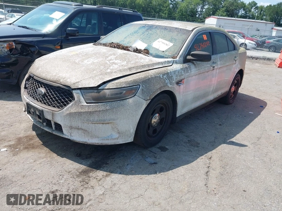 2013 Ford Police Interceptor with VIN 1FAHP2M80DG205024, listed as a IAAI auction lot 42740282 with 123,705 mi miles and . Bid and sale history available at DreamBid. Image 2.