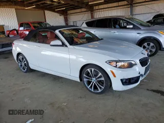 2016 BMW 2 Series 228i with VIN WBA1K9C53GV710823, listed as a Copart auction lot 84087434 with 70,822 mi miles and Salvage Title. Bid and sale history available at carsss.com. Image 4.