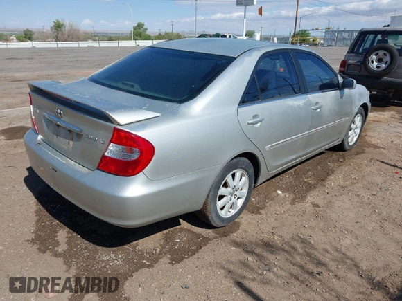 2003 Toyota Camry LE with VIN 4T1BE30K63U769219, listed as a IAAI auction lot 42178777 with 293,769 mi miles and . Bid and sale history available at DreamBid. Image 4.