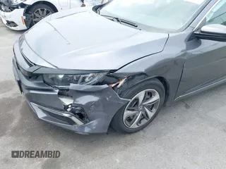 2020 Honda Civic LX z VIN 2HGFC2F60LH596396, wystawiony jako IAAI lot #42354812 z przebiegiem 62 082 mil mil oraz . Historia ofert i sprzedaży dostępna na DreamBid. Obrazek 6.