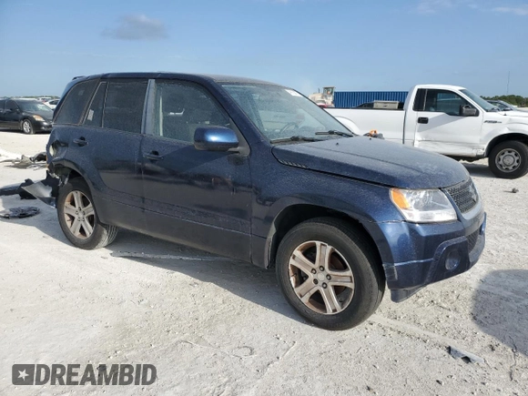 2012 Suzuki Grand Vitara Premium z VIN JS3TD0D29C4100139, wystawiony jako Copart lot #49163115 z przebiegiem 271 080 mil mil oraz Nie do naprawy. Historia ofert i sprzedaży dostępna na DreamBid. Obrazek 4.