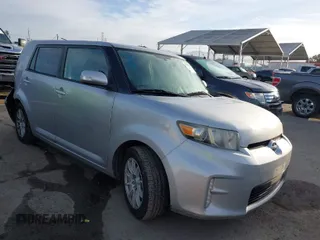 2013 Scion xB with VIN JTLZE4FE2DJ047490, listed as a IAAI auction lot 41812925 with 154,191 mi miles. Bid and sale history available at carsss.com. Image 1.