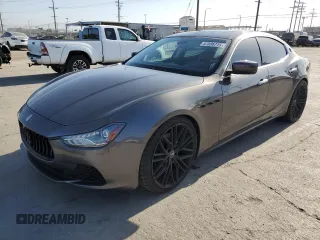 2015 Maserati Ghibli z VIN ZAM57XSA2F1159407, wystawiony jako Copart lot #57806715 z przebiegiem 93 185 mil mil oraz Szkody całkowita. Historia ofert i sprzedaży dostępna na DreamBid. Obrazek 1.