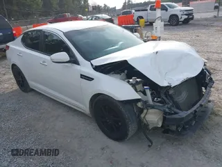 2015 Kia Optima LX with VIN KNAGM4A76F5590431, listed as a IAAI auction lot 41434500 with 123,052 mi miles. Bid and sale history available at carsss.com. Image 1.