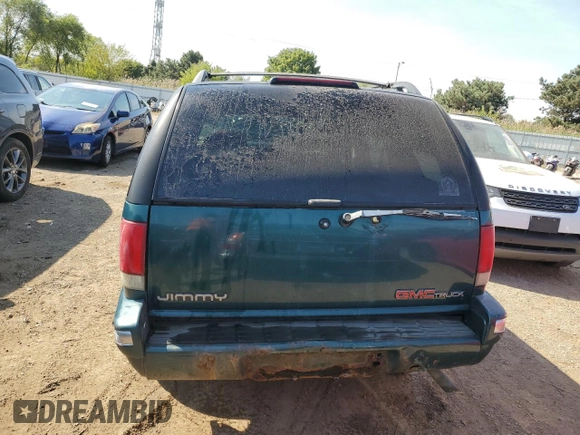 1996 GMC Jimmy SL with VIN 1GKCS13W0T2553905, listed as a Copart auction lot 71007674 with 169,513 mi miles and Salvage Title. Bid and sale history available at carsss.com. Image 6.
