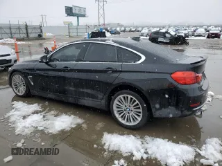 2015 BMW 4 Series 428i xDrive with VIN WBA4C9C54FD330601, listed as a Copart auction lot 45168955 with 112,408 mi miles and Salvage title. Bid and sale history available at DreamBid. Image 2.