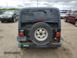 2003 Jeep Wrangler Sport z VIN 1J4FA49S13P374688, wystawiony jako Copart lot #58296735 z przebiegiem 184 554 mil mil oraz Czysty tytuł • Clean title. Historia ofert i sprzedaży dostępna na DreamBid. Obrazek 6.