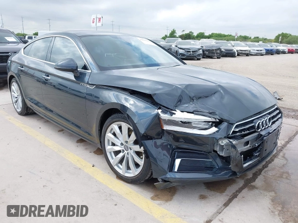 2018 Audi A5 Sportback Premium z VIN WAUANCF5XJA022221, wystawiony jako IAAI lot #42041410 z przebiegiem 94 851 mil mil oraz . Historia ofert i sprzedaży dostępna na DreamBid. Obrazek 1.