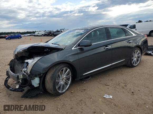 2013 Cadillac XTS Luxury z VIN 2G61P5S33D9217027, wystawiony jako Copart lot #56358835 z przebiegiem 82 644 mil mil oraz Szkoda całkowita • Salvage title. Historia ofert i sprzedaży dostępna na DreamBid. Obrazek 1.