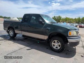 2003 Ford F-150 XL with VIN 2FTRX172X3CA58789, listed as a Copart auction lot 57986695 with 160,124 mi miles and Salvage title. Bid and sale history available at DreamBid. Image 4.