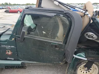 2000 Jeep Wrangler Sahara with VIN 1J4FA59SXYP785570, listed as a Copart auction lot 57659664 with 0 mi miles and Salvage Title. Bid and sale history available at carsss.com. Image 7.