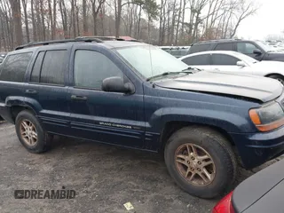 2004 Jeep Grand Cherokee Laredo with VIN 1J4GW48N04C220886, listed as a IAAI auction lot 41473522 with 146,156 mi miles. Bid and sale history available at carsss.com. Image 1.