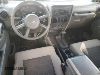 2008 Jeep Wrangler Unlimited X with VIN 1J4GB39108L608465, listed as a Copart auction lot 50949015 with 103,205 mi miles and Salvage Title. Bid and sale history available at DreamBid. Image 8.