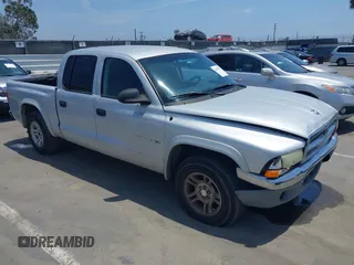 2002 Dodge Dakota SLT z VIN 1B7HL48N92S714721, wystawiony jako IAAI lot #42495510 z przebiegiem 195 609 mil mil oraz . Historia ofert i sprzedaży dostępna na DreamBid. Obrazek 1.