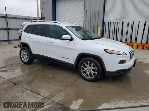 2015 Jeep Cherokee Latitude with VIN 1C4PJLCB9FW532301, listed as a Copart auction lot 52379335 with 153,845 mi miles and Salvage Title. Bid and sale history available at DreamBid. Image 4.