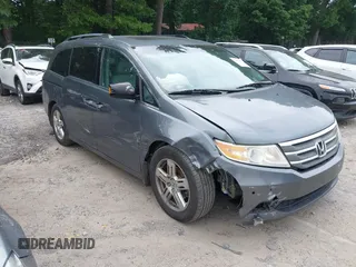 2011 Honda Odyssey Touring with VIN 5FNRL5H94BB048555, listed as a IAAI auction lot 42411179 with 199,903 mi miles and . Bid and sale history available at DreamBid. Image 1.
