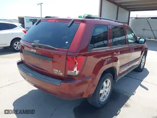 2009 Jeep Grand Cherokee Laredo with VIN 1J8GS48K39C521160, listed as a IAAI auction lot 42039577 with 262,829 mi miles. Bid and sale history available at carsss.com. Image 4.