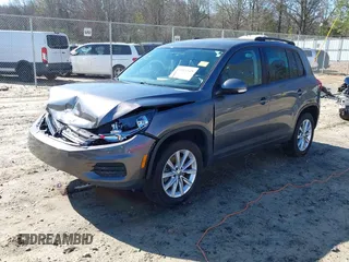 2014 Volkswagen Tiguan SE z VIN WVGAV3AX0EW511694, wystawiony jako IAAI lot #41811345 z przebiegiem 95 129 mil mil oraz . Historia ofert i sprzedaży dostępna na DreamBid. Obrazek 17.