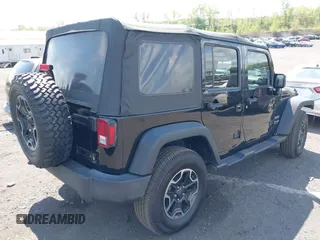 2018 Jeep Wrangler JK Unlimited Sport S with VIN 1C4BJWDG9JL816592, listed as a IAAI auction lot 42187279 with 91,169 mi miles. Bid and sale history available at carsss.com. Image 4.