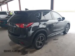 2016 Mazda CX-5 Touring with VIN JM3KE2CY2G0808424, listed as a IAAI auction lot 41880494 with 149,005 mi miles. Bid and sale history available at carsss.com. Image 4.