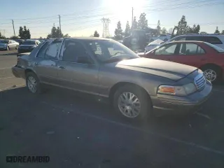 2005 Ford Crown Victoria LX with VIN 2FAFP74W75X129929, listed as a Copart auction lot 89020125 with 156,115 mi miles and Salvage Title. Bid and sale history available at carsss.com. Image 4.