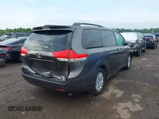 2014 Toyota Sienna XLE with VIN 5TDYK3DC0ES496716, listed as a IAAI auction lot 42494549 with 158,645 mi miles and . Bid and sale history available at DreamBid. Image 4.