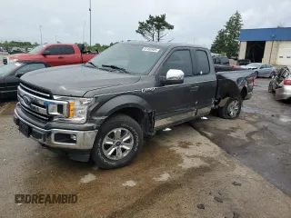 2018 Ford F-150 XL with VIN 1FTEX1E52JKE41145, listed as a Copart auction lot 61460985 with 157,825 mi miles and Salvage title. Bid and sale history available at DreamBid. Image 1.