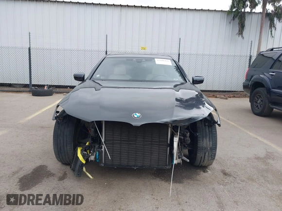 2019 BMW 7 Series 750i with VIN WBA7F0C50KGM26010, listed as a IAAI auction lot 42188421 with 71,576 mi miles and . Bid and sale history available at DreamBid. Image 13.