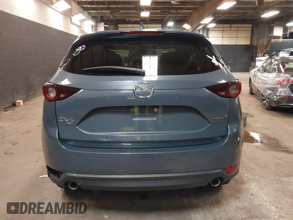 2021 Mazda CX-5 Touring with VIN JM3KFBCM5M0394707, listed as a IAAI auction lot 41887973 with 44,670 mi miles. Bid and sale history available at carsss.com. Image 17.