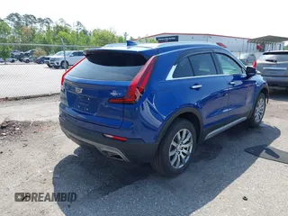2023 Cadillac XT4 FWD Premium Luxury with VIN 1GYFZCR43PF104796, listed as a IAAI auction lot 41931695 with 12,666 mi miles. Bid and sale history available at carsss.com. Image 4.