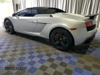 2013 Lamborghini Gallardo z VIN ZHWGU6BZ7DLA12811, wystawiony jako Copart lot #51696395 z przebiegiem 35 389 mil mil oraz Szkody całkowita. Historia ofert i sprzedaży dostępna na DreamBid. Obrazek 2.