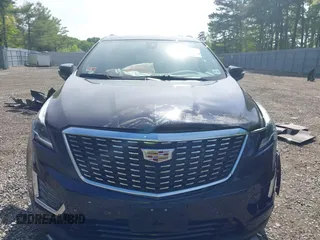 2021 Cadillac XT5 AWD Premium Luxury z VIN 1GYKNDRS8MZ217572, wystawiony jako IAAI lot #42190571 z przebiegiem 25 100 mil mil oraz . Historia ofert i sprzedaży dostępna na DreamBid. Obrazek 12.