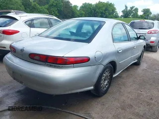 1997 Mercury Sable LS z VIN 1MELM53S5VA661602, wystawiony jako IAAI lot #42210072 z przebiegiem 106 344 mil mil oraz . Historia ofert i sprzedaży dostępna na DreamBid. Obrazek 4.