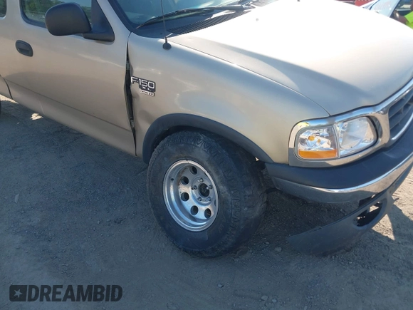 2000 Ford F-150 XL z VIN 1FTRX18W7YNA73804, wystawiony jako IAAI lot #42779753 z przebiegiem 228 666 mil mil oraz . Historia ofert i sprzedaży dostępna na DreamBid. Obrazek 6.