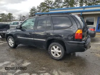 2006 GMC Envoy SLT with VIN 1GKDS13S762258032, listed as a Copart auction lot 88677095 with 184,188 mi miles and Salvage Title. Bid and sale history available at carsss.com. Image 2.