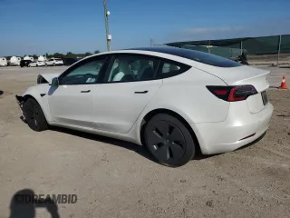 2021 Tesla Model 3 Standard Range Plus with VIN 5YJ3E1EA4MF089259, listed as a Copart auction lot 75398924 with 32,166 mi miles and Salvage Title. Bid and sale history available at DreamBid. Image 2.