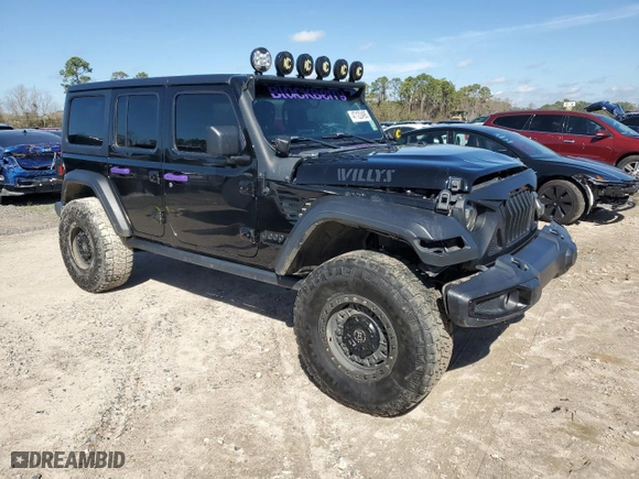 2021 Jeep Wrangler Unlimited Willys with VIN 1C4HJXDN3MW680459, listed as a Copart auction lot 47122495 with 65,298 mi miles and Salvage Title. Bid and sale history available at carsss.com. Image 4.