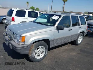 1994 Jeep Grand Cherokee Laredo with VIN 1J4GZ58S4RC325909, listed as a IAAI auction lot 39580601 with 162,952 mi miles. Bid and sale history available at carsss.com. Image 2.