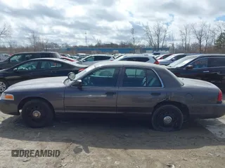 2007 Ford Police Interceptor z VIN 2FAFP71W97X155407, wystawiony jako IAAI lot #41881583 z przebiegiem Nie podano mil oraz . Historia ofert i sprzedaży dostępna na DreamBid. Obrazek 14.